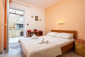 Posteľ alebo postele v izbe v ubytovaní Apartment EVALA