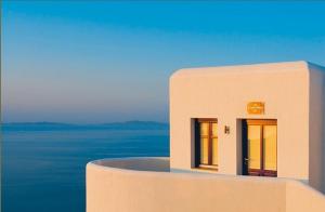 a model of a building with the ocean in the background at Pegados Villas in Chora Folegandros