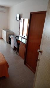 Μια τηλεόραση ή/και κέντρο ψυχαγωγίας στο Appartamenti per Vacanza Manfredi Vieste, Fronte mare con parcheggio