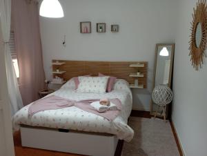 מיטה או מיטות בחדר ב-Piso grande con terraza