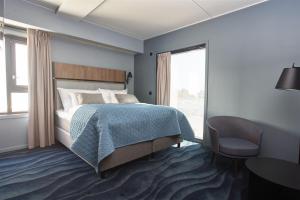 
En eller flere senger på et rom på Quality Hotel Grand Larvik

