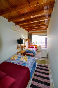 Ein Bett oder Betten in einem Zimmer der Unterkunft Jasmine Hotel&Restaurant