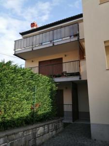 a building with a bush in front of it at Sun & Love Apartment in Koper