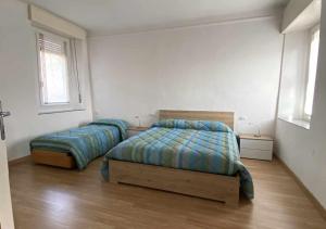 Postel nebo postele na pokoji v ubytování Casa Vacanza Amelia