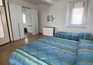 Postel nebo postele na pokoji v ubytování Casa Vacanza Amelia