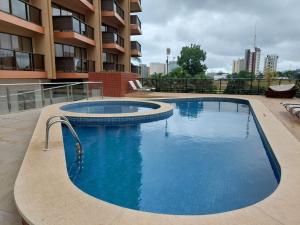 Piscina a Flat Particular Hotel Kubitschek o a prop