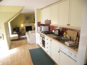 a kitchen with a sink and a stove top oven at CENTRAL Calton Hill What a view in Edinburgh