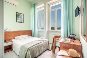 Postel nebo postele na pokoji v ubytování Villa MG Hotel + 37 fotografií