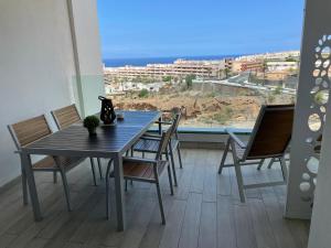A balcony or terrace at Ocean Garden Sunset Apartment - heated swimming pool Free WIFI