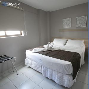 Giường trong phòng chung tại Hotel Enseada Boa Viagem