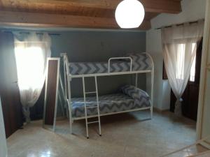a room with two bunk beds in a room at A Taverna Intru U Vicu in Belmonte Calabro
