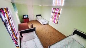 an overhead view of a bedroom with two beds at Soliha&Yulduz Guesthouse in Bukhara