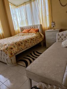 Tempat tidur dalam kamar di Casa de campo Pillaro - Activa