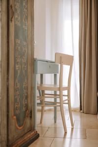 a desk and a chair next to a window at Dimora Anderì in Polignano a Mare +37 photos