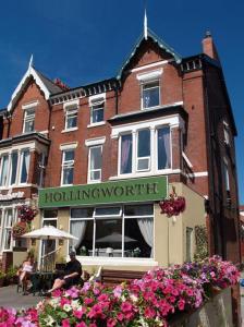 a building with a sign for a hollingworthicist at The Hollingworth in Lytham St Annes