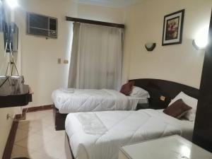 Postelja oz. postelje v sobi nastanitve Eiffel Hotel Hurghada