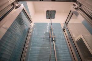 an elevator in a building with a glass floor at B&B DORIA in Naples