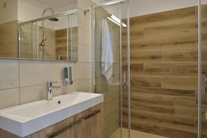 a bathroom with a sink and a shower at Hotel Stella Di Mare in Ajaccio
