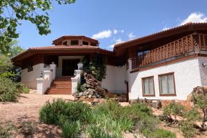 a house with a balcony on top of it at Sedona Serenity in Sedona