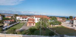 an aerial view of a house with a yard at Luxury apartment Faro with sea view and swimming pool in Premantura