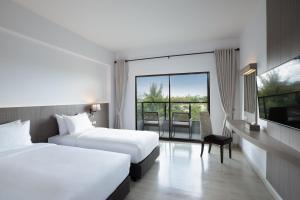 Postel nebo postele na pokoji v ubytování Centara Life Cha-Am Beach Resort Hua Hin