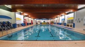 a large swimming pool in a building at Ocean Edge Holiday Park Family holiday home with spectacular sea views in Heysham