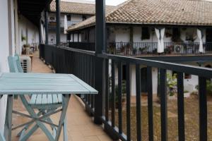 a blue bench sitting on the balcony of a house at Vista Corral del Conde in Seville
