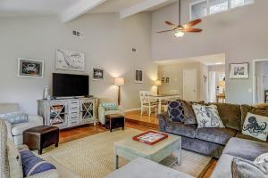 a living room with a couch and a tv at Pender Lane 13 in Hilton Head Island