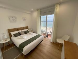 A bed or beds in a room at Oktheway Perbes Beach 2
