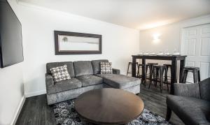 a living room with a couch and a table at Novlan Suite by Revelstoke Vacations in Revelstoke