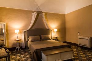 Letto o letti in una camera di Borgo del Carato