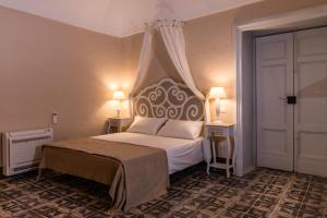 Letto o letti in una camera di Borgo del Carato