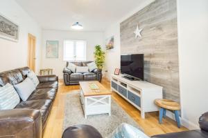 TV a/nebo společenská místnost v ubytování Quayside House