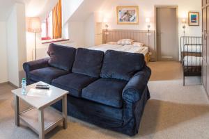 Rúm í herbergi á Hotel Dvur Hoffmeister