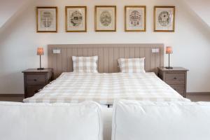 Rúm í herbergi á Hotel Dvur Hoffmeister