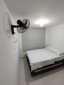 Postel nebo postele na pokoji v ubytování CONDOMINIO PEÑA AZUL LA MORADA