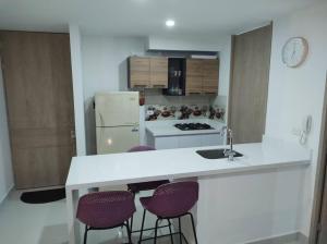 Kuchyň nebo kuchyňský kout v ubytování CONDOMINIO PEÑA AZUL LA MORADA