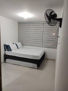 Postel nebo postele na pokoji v ubytování CONDOMINIO PEÑA AZUL LA MORADA