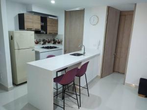 Kuchyň nebo kuchyňský kout v ubytování CONDOMINIO PEÑA AZUL LA MORADA