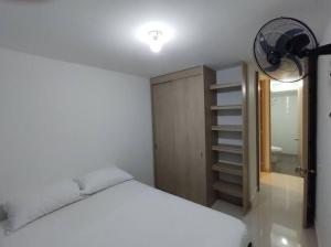 Postel nebo postele na pokoji v ubytování CONDOMINIO PEÑA AZUL LA MORADA