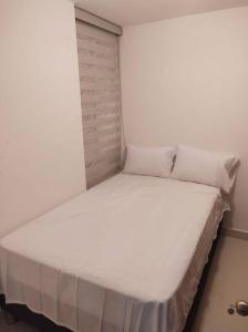 Postel nebo postele na pokoji v ubytování CONDOMINIO PEÑA AZUL LA MORADA