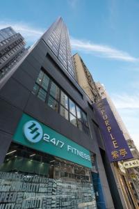 a building with a sign on the side of it at Hotel Purple Hong Kong in Hong Kong