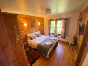 Postel nebo postele na pokoji v ubytování Hotel Andes Pucón