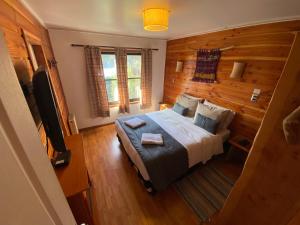 Postel nebo postele na pokoji v ubytování Hotel Andes Pucón