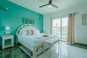 A bed or beds in a room at Green Coast Hotel