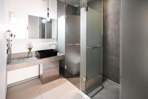 a bathroom with a shower and a sink at Hotel The Designers Hongdae in Seoul