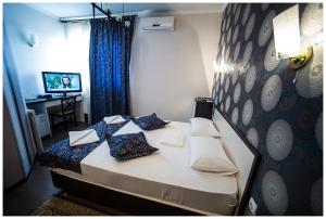 Katil atau katil-katil dalam bilik di IRIS Hotel