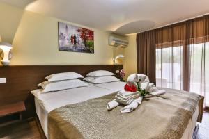 Katil atau katil-katil dalam bilik di Hotel Premier
