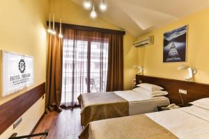 Katil atau katil-katil dalam bilik di Hotel Premier