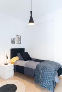 A bed or beds in a room at AT TRAJANO 1